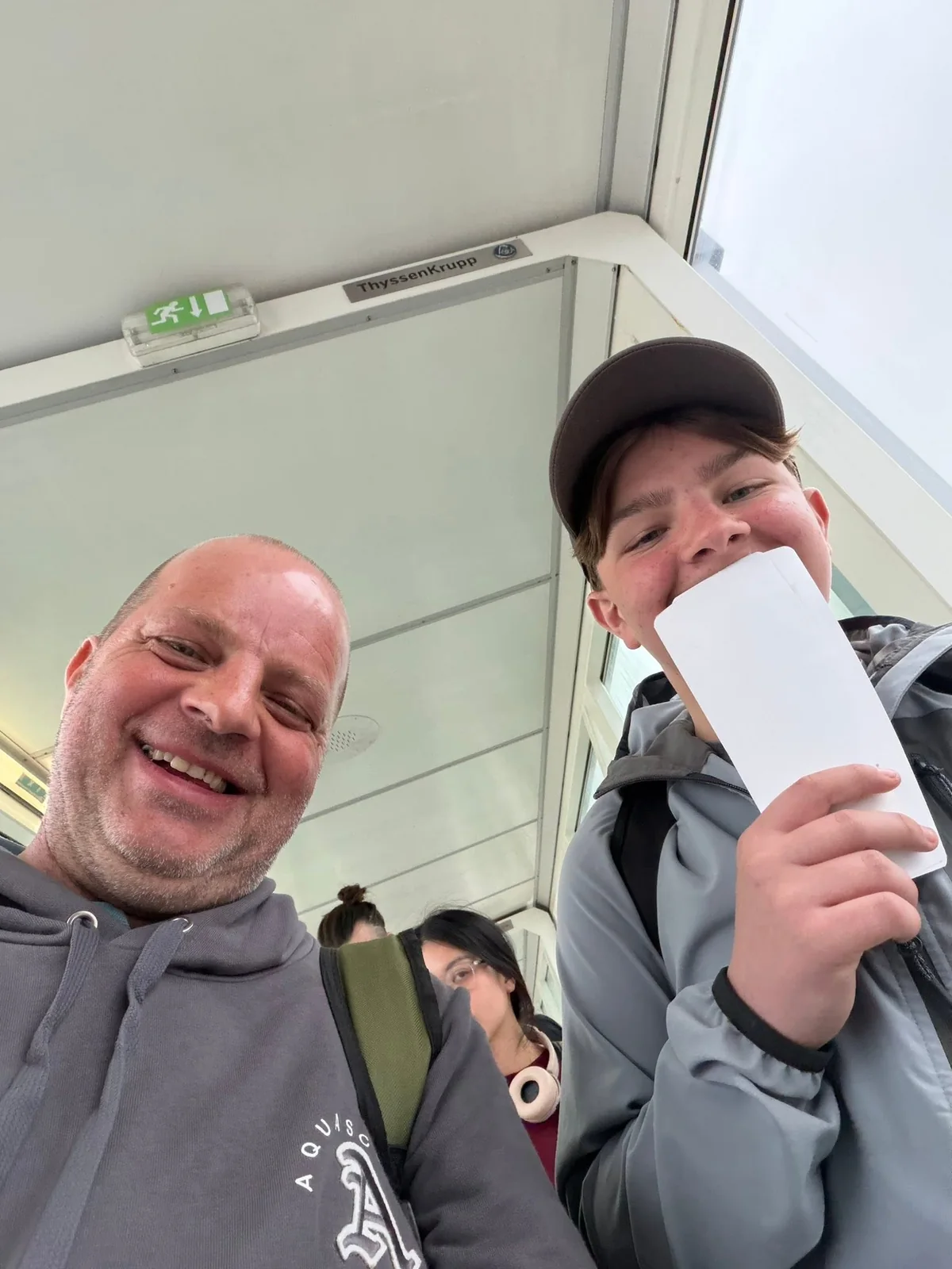 Vinny and Tyler smiling together while travelling on their fishing holiday.